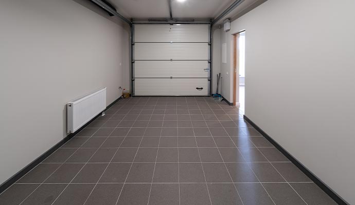 Clean tile and grout in commercial garage