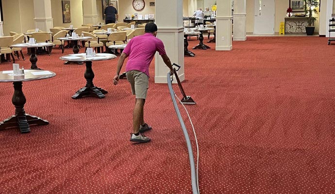 Professional carpet cleaning with equipment