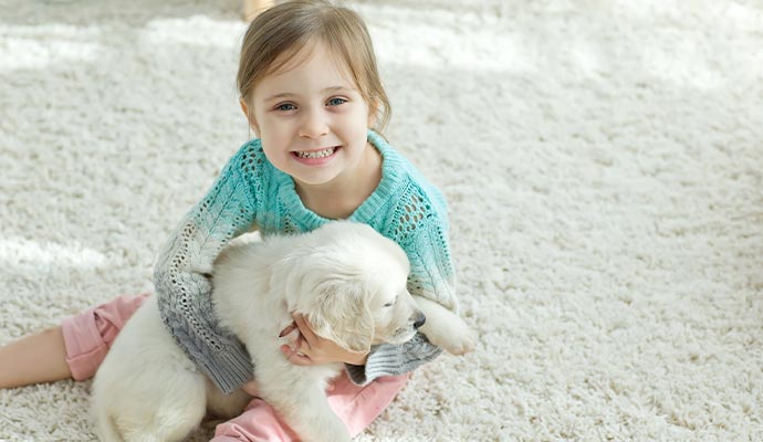 Children playing with dog