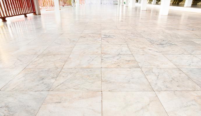 Clean and polished light-colored marble tile floor
