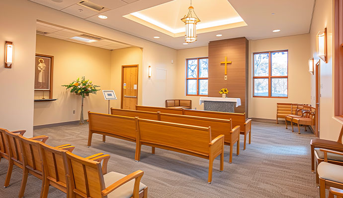 Modern chapel interior with wooden pews and altar