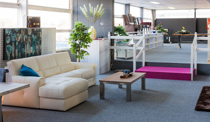 Upholstered sectional couch in retail furniture showroom