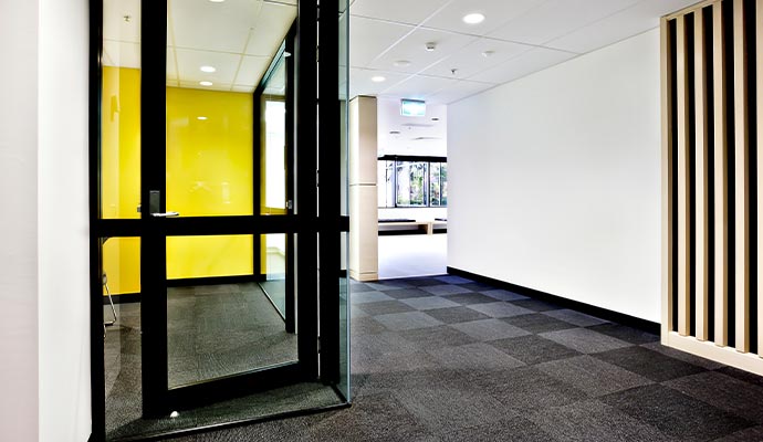 Commercial office interior with carpeted hallway