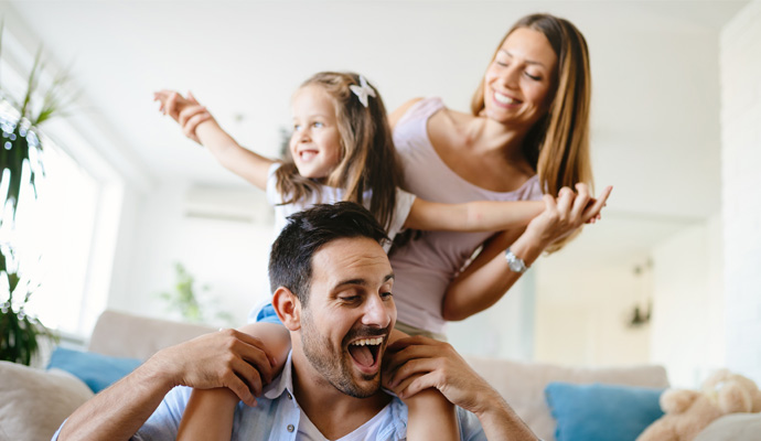 Happy family in a room enjoying better indoor air quality