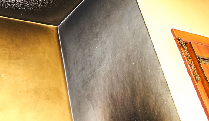 Smoke and soot damaged wall and ceiling