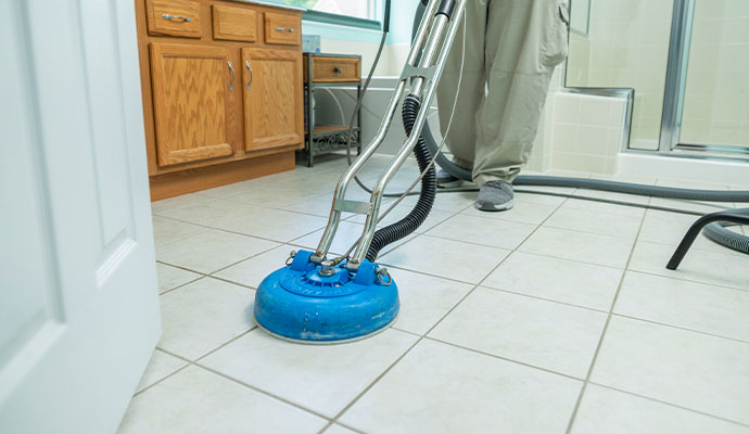 Professional floor cleaning with equipment.