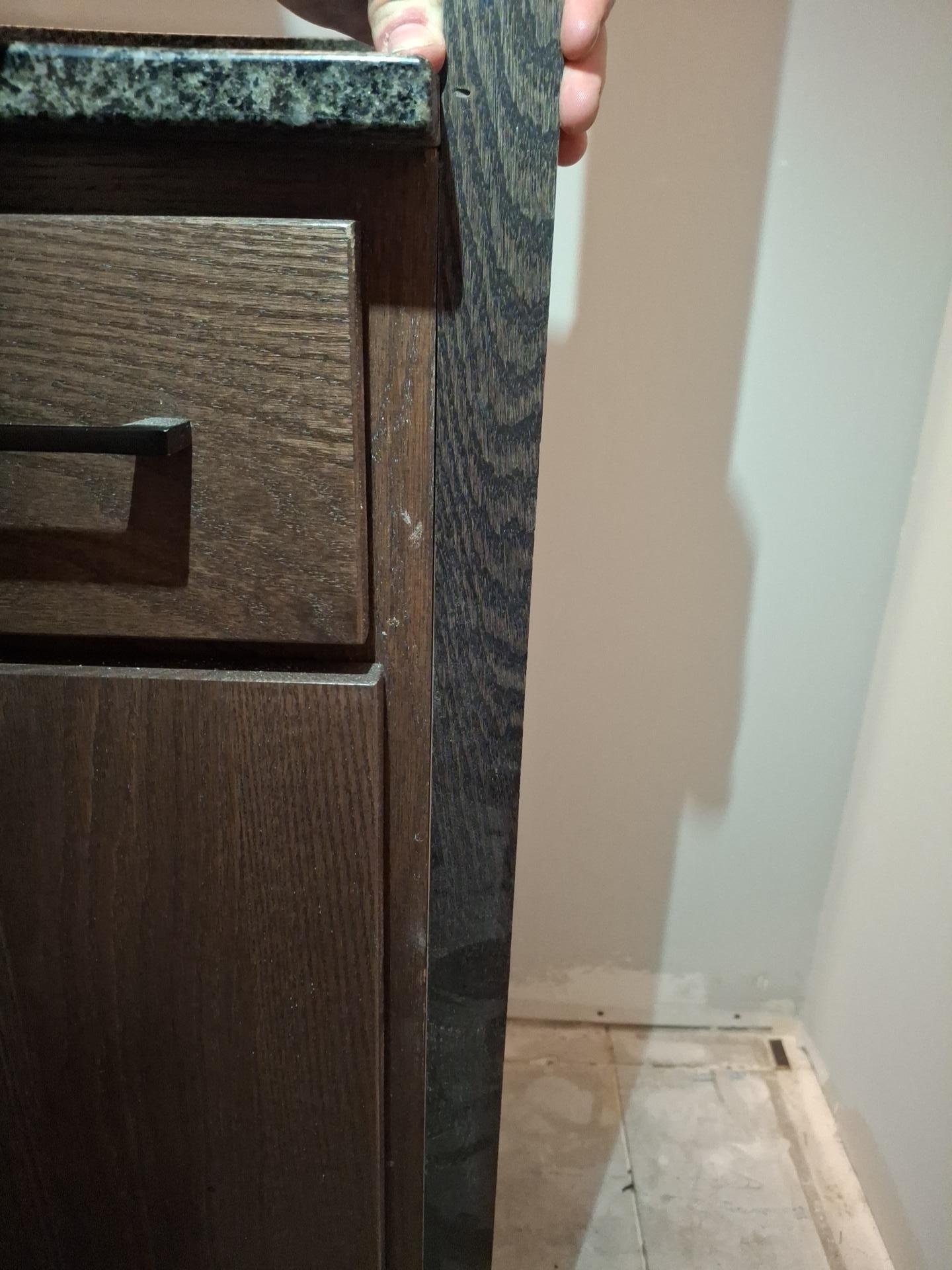 Freshly painted wall and baseboard in a fully restored residential room after water damage reconstruction.