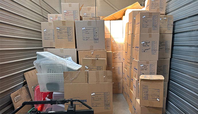 Metal storage locker stacked cardboard