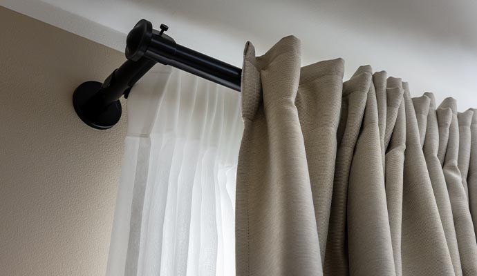 Modern drapery setup with pleated folds and layered fabric