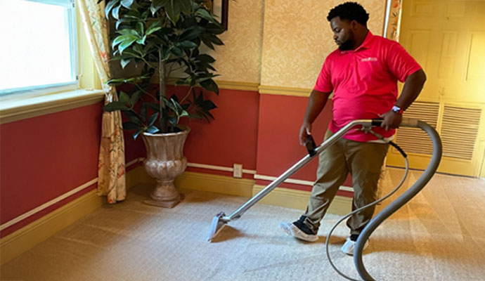 Professional carpet cleaning service using equipment