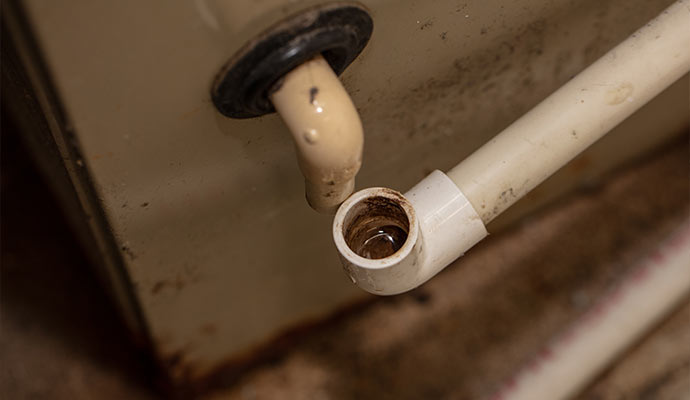 Close up view of unconnected ac drain line pipe