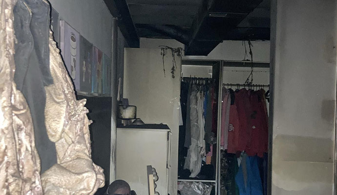 Smoke residue and soot damage on walls and clothes