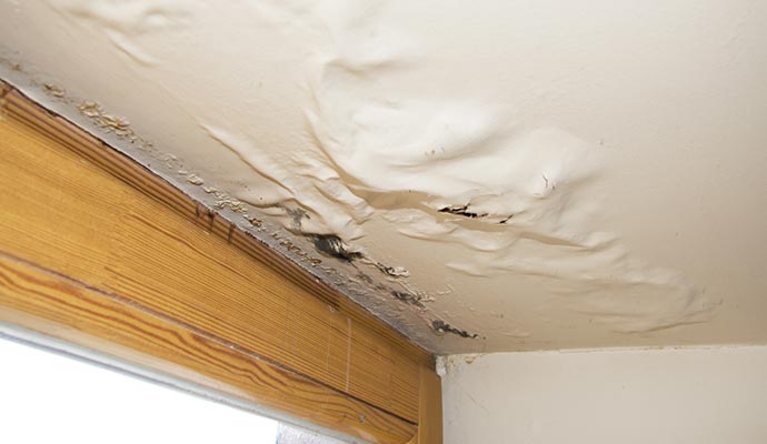 Water damaged ceiling due to roof leak