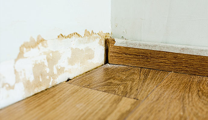 Water damaged floor and wall