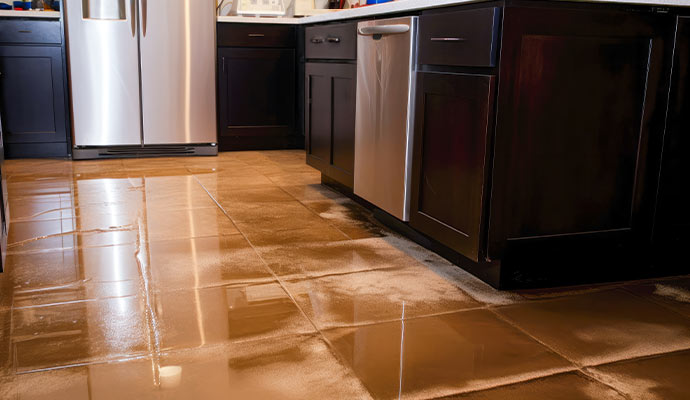 Water damaged kitchen floor due to appliance leakage