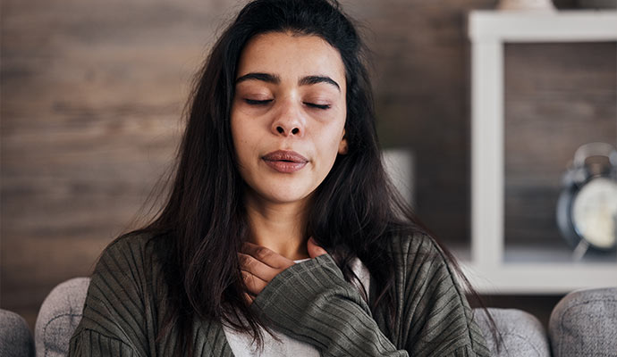 Woman having breathing issues due to mold exposure