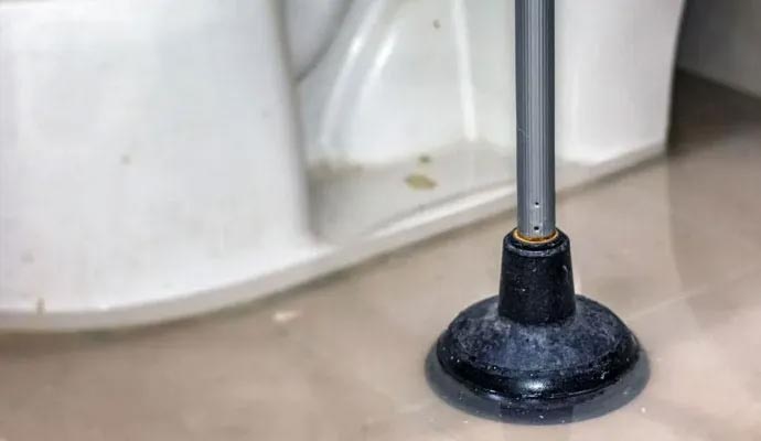Toilet floor flooded due to sewage leakage