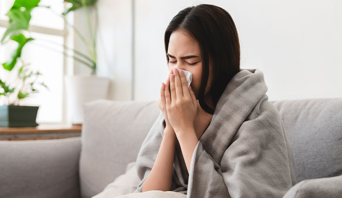 Woman sneezing