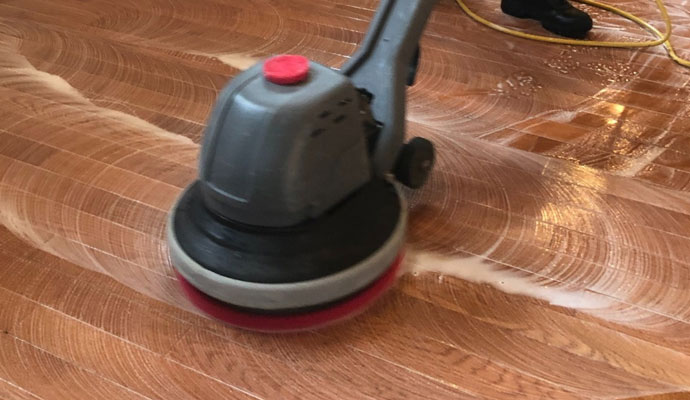 cleaning wood floor by the Teasdale Columbus